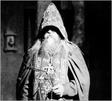 photograph of a hieroschemamonk holding a prayer rope